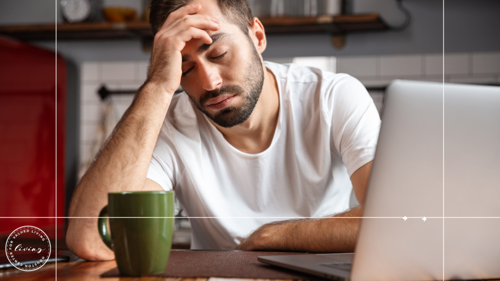 Image of a man sitting and looking fatigued wondering if he has a sleep disorder